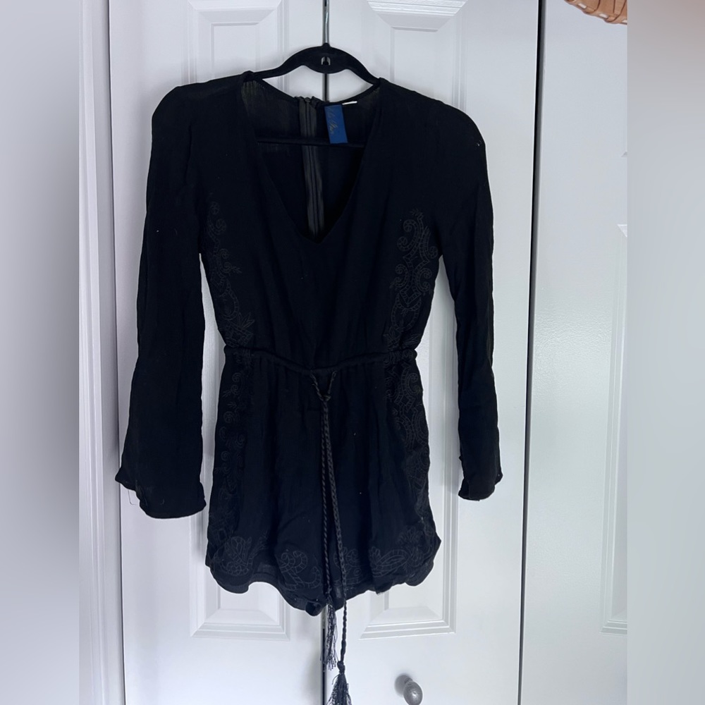 Francesca’s black tie waist long sleeve romper with lace embroidery detail - S